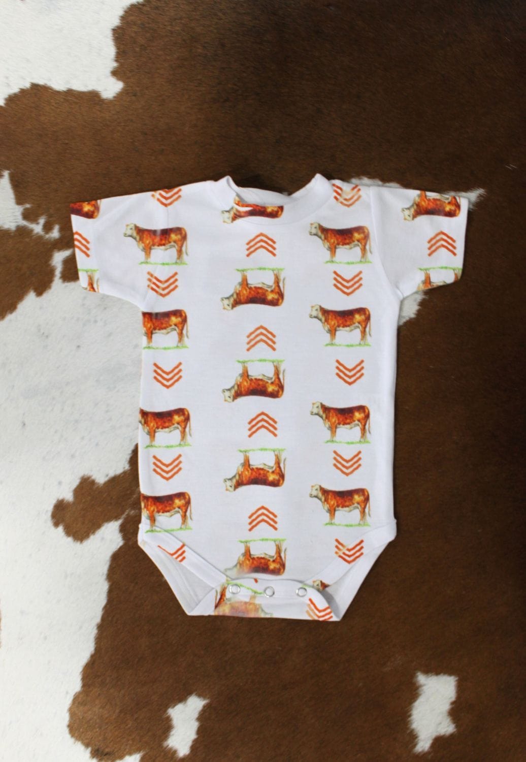 The Whole Herd CLOTHING-Infants The Whole Herd Hereford Print Onesie